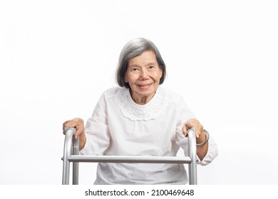 Portrait Of A Cute Smiling Elderly Asian Woman Looking At Camera Isolated On White. Mature Old Lady Close Up Portrait.