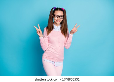 Portrait of cute sweet lovely high school student enjoy campus lesson lecture make v-sign wear good look clothes isolated over blue color background