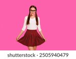 Portrait of cute tails lady youth touch skirt red checked plaid feel positive content have eyewear eyeglasses specs dressed modern fashionable clothes isolated bright background