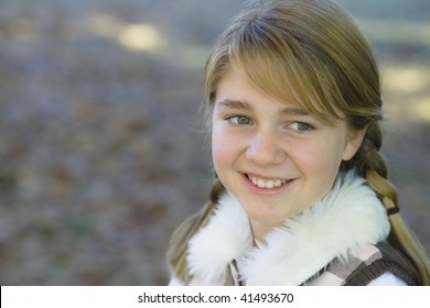 Portrait Of A Cute Tween Girl Outdoors