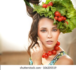 Portrait of a cute woman with hair style made of vegetables