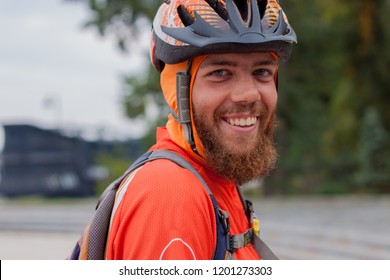 Portrait Of A Cyclist With Helmet And Smiling