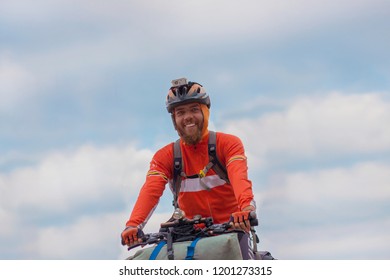 Portrait Of A Cyclist With Helmet And Smiling