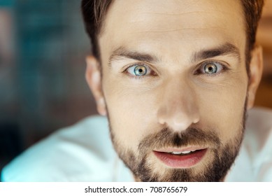 Portrait Of Delighted Man That Looking Forward