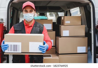 Portrait of delivery man wearing face protective mask for coronavirus spread prevention