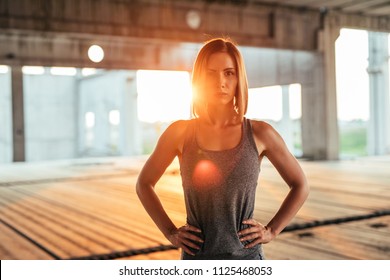 Portrait Of A Determined Young Athlete Woman. Warm Tones.