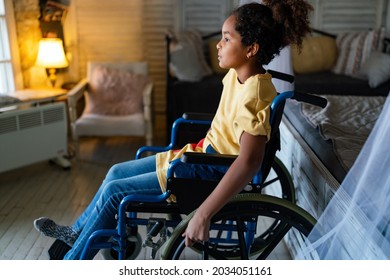 Portrait Of Disabled Black Girl With Wheelchair At Home