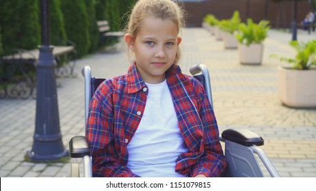portrait of a disabled child in a chair