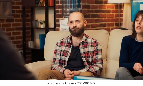 Portrait Of Displeased Man Talking About Marriage With Counselor, Attending Couple Therapy Session With Wife. Person Doing Counseling Meeting To Solve Conflict And Divorce Problems.