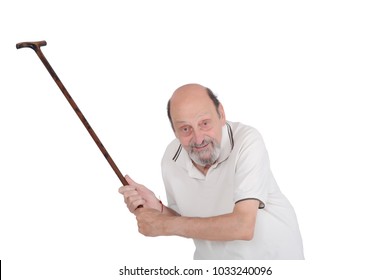 Portrait of displeased old man holding a cane and scolding someone towards the camera isolated on white background
