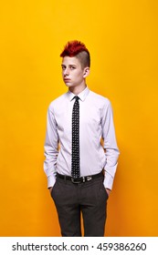 Portrait Of Displeased Teen Punk In Shirt And Tie Looking Away With Hands In Pockets.Isolated