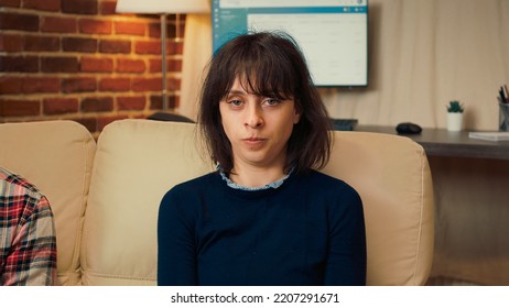 Portrait Of Displeased Wife Doing Counseling Session With Therapist And Husband, Talking About Relationship Problems. Woman Attending Psychotherapy Meeting To Solve Conflict With Counselor.