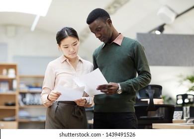 Portrait Of Diverse Business People Discussing Project In Office, Copy Space