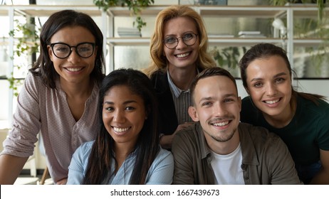 Portrait Of Diverse Multiethnic Smiling Businesspeople Look At Camera Pose For Company Group Picture Together, Happy Multiracial Colleagues Coworkers Show Unity And Support Cooperating At Workplace