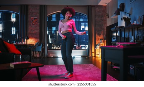 Portrait of Diverse Multiethnic Young Latin Female Dancing in Futuristic Neon Glowing Glasses, Having a Party at Home in Loft Apartment. Recording Funny Viral Videos for Social Media. - Shutterstock ID 2155331355