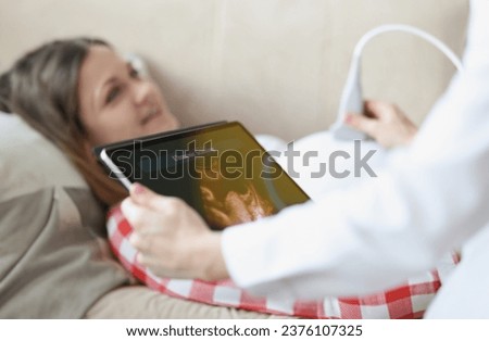 Similar – Female doctor showing an x-ray on the tablet