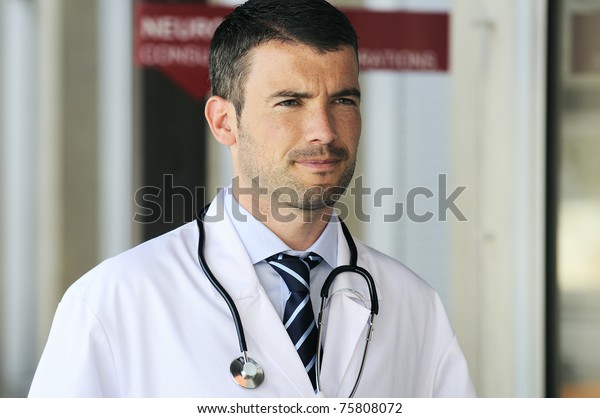 portrait\
of doctor in front an entrance of the\
hospital