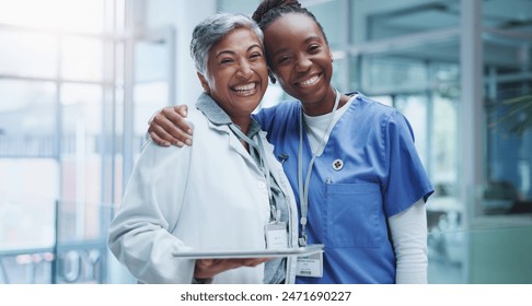 Portrait, doctor hug and nurse woman in hospital with smile for healthcare, collaboration or support. Embrace, medical team and professional health workers for happiness, teamwork or solidarity - Powered by Shutterstock