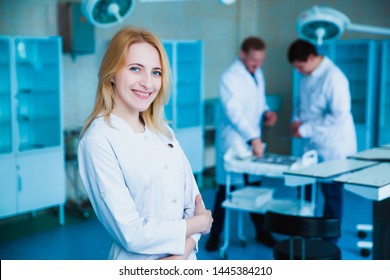 Portrait Of A Doctor Intern. Medical Students Profession Staff. Multinational People - Doctor, Nurse And Surgeon. A Group Of Graduates Of A Medical University In A Surgical Room. Nursing School