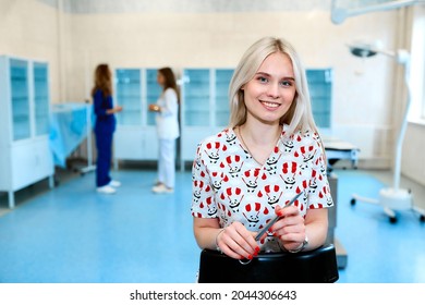 Portrait Of A Doctor Intern. Medical Students Profession Staff. Multinational People - Doctor, Nurse And Surgeon. A Group Of Graduates Of A Medical University In A Surgical Room. Nursing School