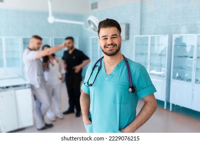 Portrait of a doctor intern. Medical students profession staff. multinational people - doctor, nurse and surgeon. A group of graduates of a medical university in a surgical room. Nursing School - Powered by Shutterstock