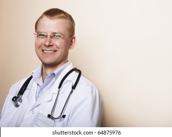 Portrait Of Doctor Man With Friendly Smile. Space For Text.