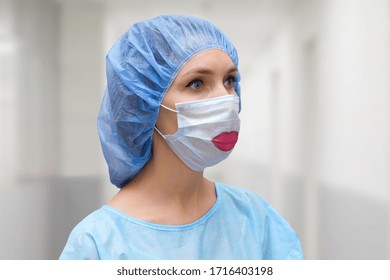 Portrait of a doctor in a mask, on which a lips is drawn. - Shutterstock ID 1716403198