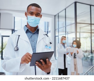 Portrait Of Doctor With Mask And Tablet During Covid For Bacteria, Medicine Or Corona Virus Research. Safety, Protection And Black Medical Healthcare Worker Or Hospital Employee Doing Telehealth Work