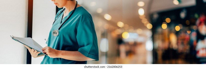 Portrait Of Doctor Or Nurse Examining Senior Male Patient In Hospital Room. Banner Cover Design.