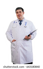 Portrait of a doctor on a white background. The doctor smiles and looks into the camera. He has a stethoscope on his neck.