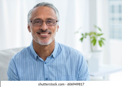 Portrait of doctor smiling at home