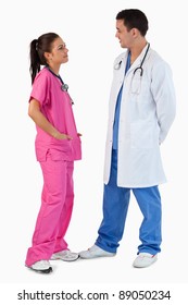 Portrait Of Doctors Talking Against A White Background