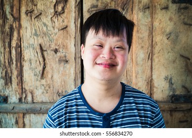 Portrait of Down syndrome boy smile with camera