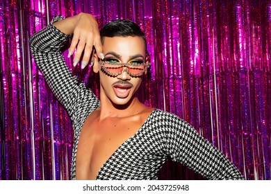 portrait of drag queen diva with fuchsia glitter background - Shutterstock ID 2043725948