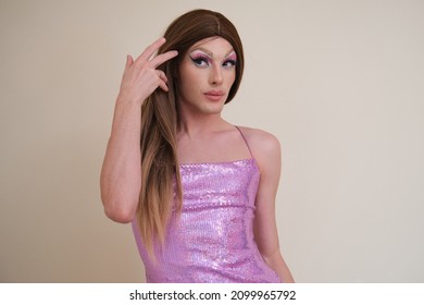 Portrait of a drag queen person wearing sequined pink dress posing. - Shutterstock ID 2099965792