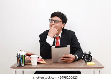 Portrait of dream dreamy asian businessman working using tablet computer look copyspace think thoughts create development report. isolated over white background - Powered by Shutterstock