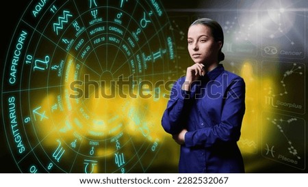 Portrait of dreamy young female on background with horoscope astrological signs