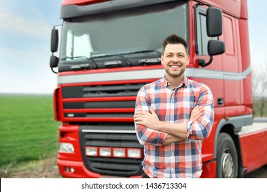 Portrait of driver at modern truck outdoors