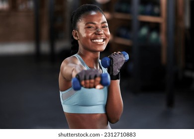 Portrait, dumbbell or happy girl boxing in training, exercise or workout for a strong powerful punch in gym. Smile, face or black woman boxer with dumbbells, weights or exercising in fitness club