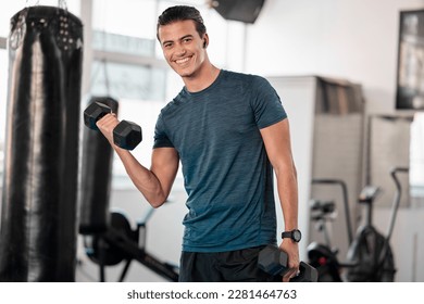 Portrait, dumbbells and man in gym smile with earphones for streaming music while exercising. Sports workout, fitness and happy bodybuilder or athlete lifting weights for exercise, health and muscle. - Powered by Shutterstock