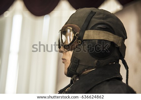 Portrait of dummy of pilot of airplane in a helmet and glasses.