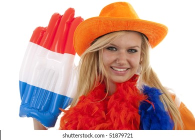 Portrait Of Dutch Soccer Fan In Orange Outfit With Big Glasses, Hat And Big Hand Over White Background