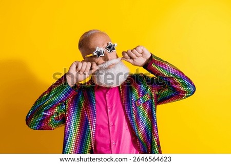 Portrait of eccentric funky aged man curl mustache wear shiny costume isolated on yellow color background