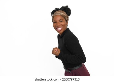 Portrait Of Ecstatic African American Woman. Female Model In Turtleneck With Curly Hair Looking At Camera, Gesturing. Portrait, Studio Shot, Emotion Concept