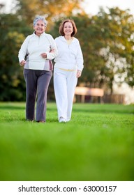 Portrait Of An Elder Mother And Daughter Walking Outdoors