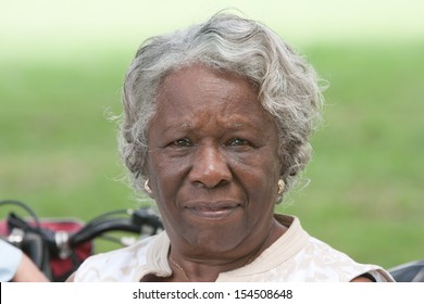 Portrait elderly african american lady outside during the day