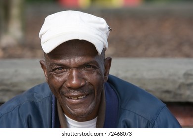 Portrait of elderly African American man outside in the daytime.
