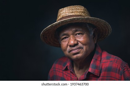 Portrait Elderly Asian Man Wearing A Hat Smile And Looking At Camera On Black Background In The Studio.