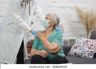 Portrait Of Elderly Caucasian Woman Wearing Protective Medical Mask. Care For The Elderly People During Corona Virus Outbreak, A Helping Hand, Home Care Concept.