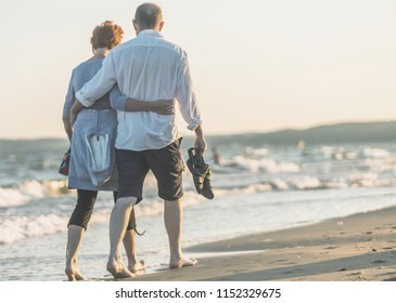 Portrait of an elderly couple hugging - Powered by Shutterstock